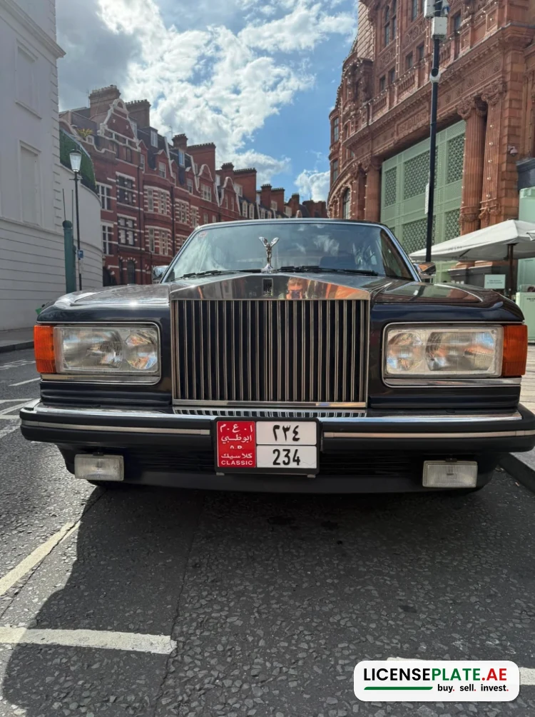Front of the Rolls-Royce Silver Spur II with Abu Dhabi Classic plate 234, parked in Knightsbridge with red-brick London buildings behind it.
